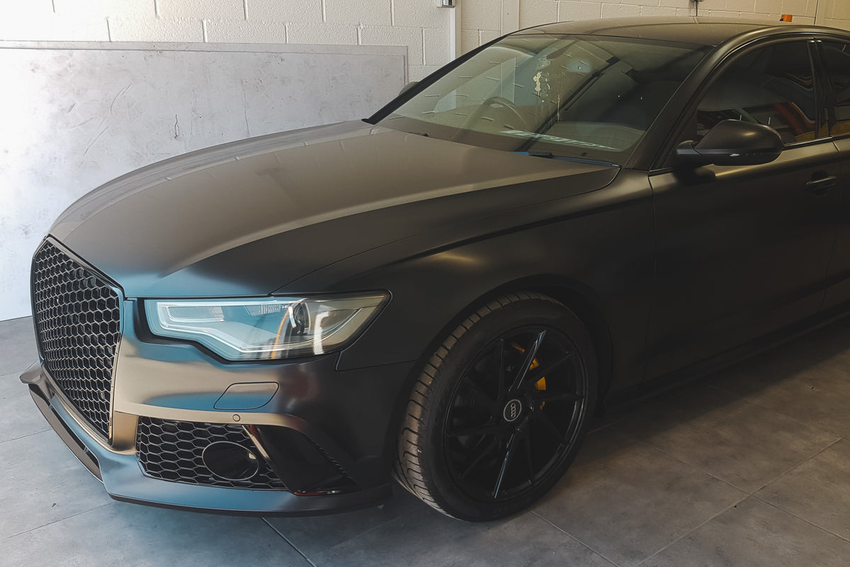Satin-black Audi wrap by Wraptastic, front three-quarter view