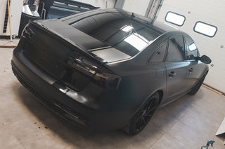 Satin-black Audi wrap by Wraptastic, rear three-quarter view