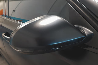 Close-up of the satin-black wrapped Audi door mirror