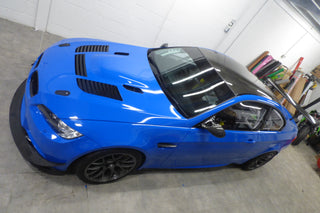 BMW M3 race car wrapped in 3M Gloss Blue with bonnet vents, viewed from above