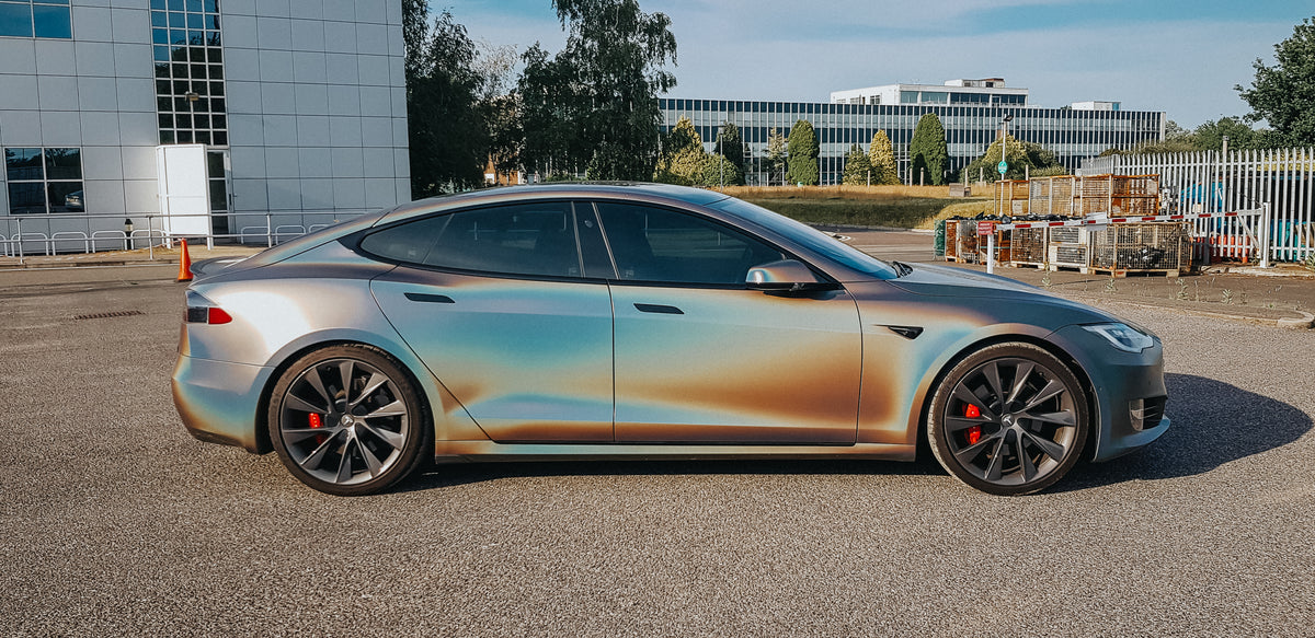 Tesla Model S with a colour-shifting wrap by Wraptastic, side profile in daylight