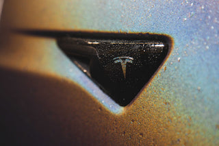 Close-up of the colour-shifting wrap around the Tesla badge