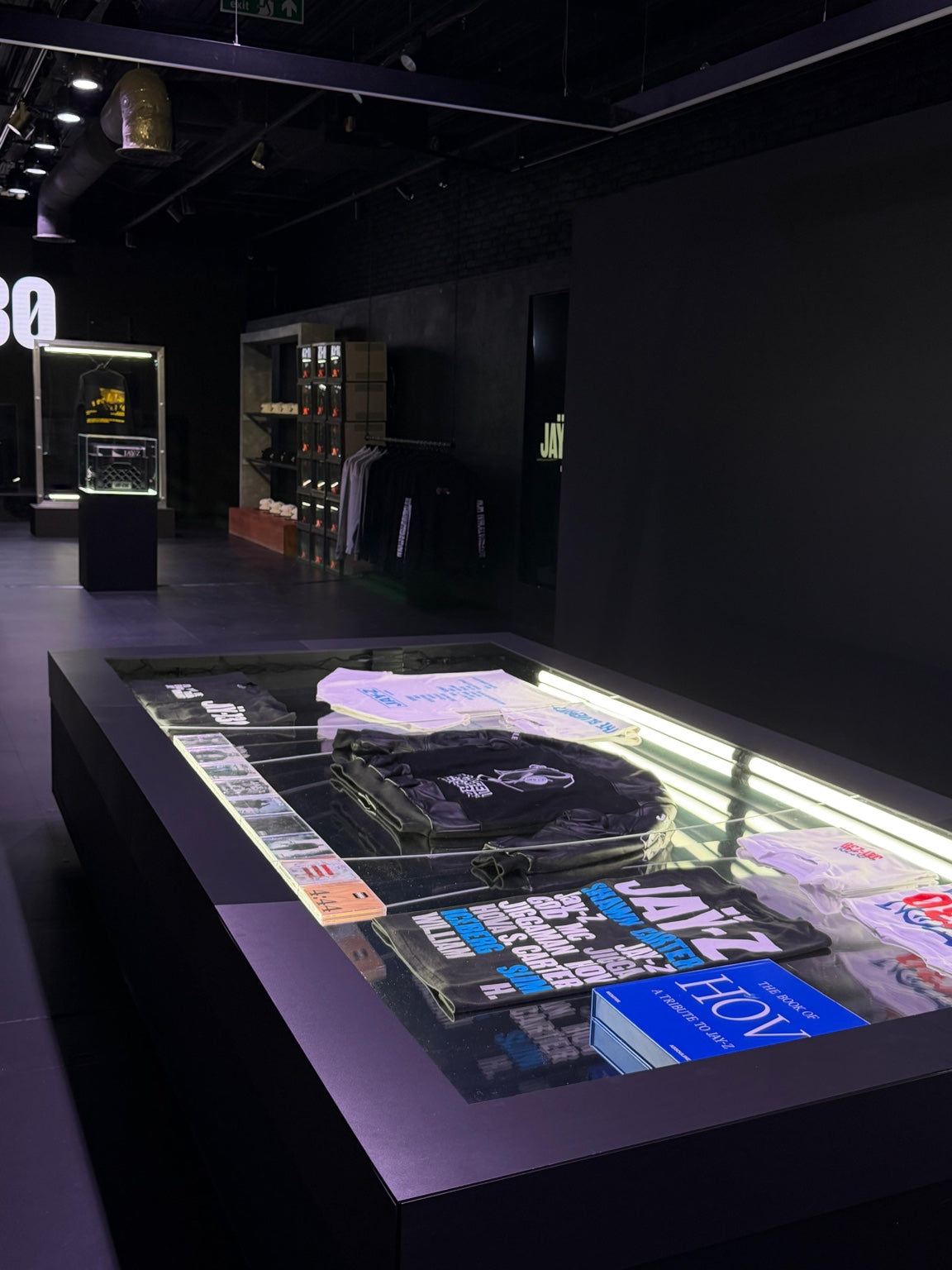 Glass merchandise counter in the JAY-Z pop-up shop installed by Wraptastic in Camden Town
